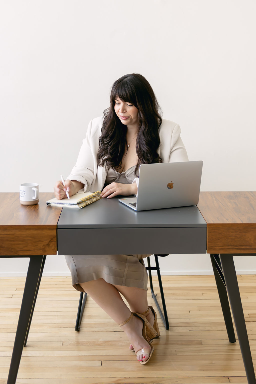 Jessica Caceres working through practice systems at her desk